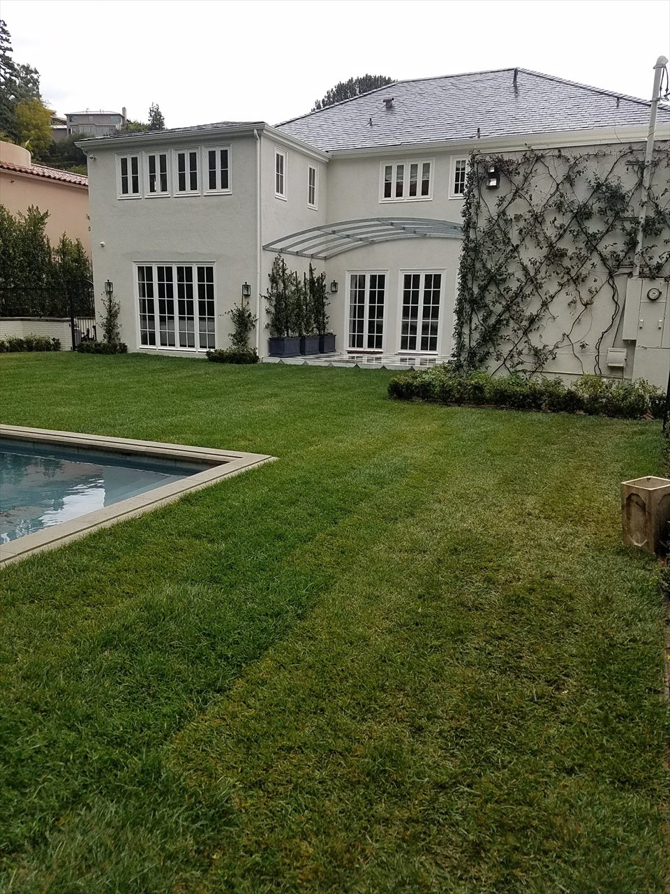 Completed residential home and landscaped pool area